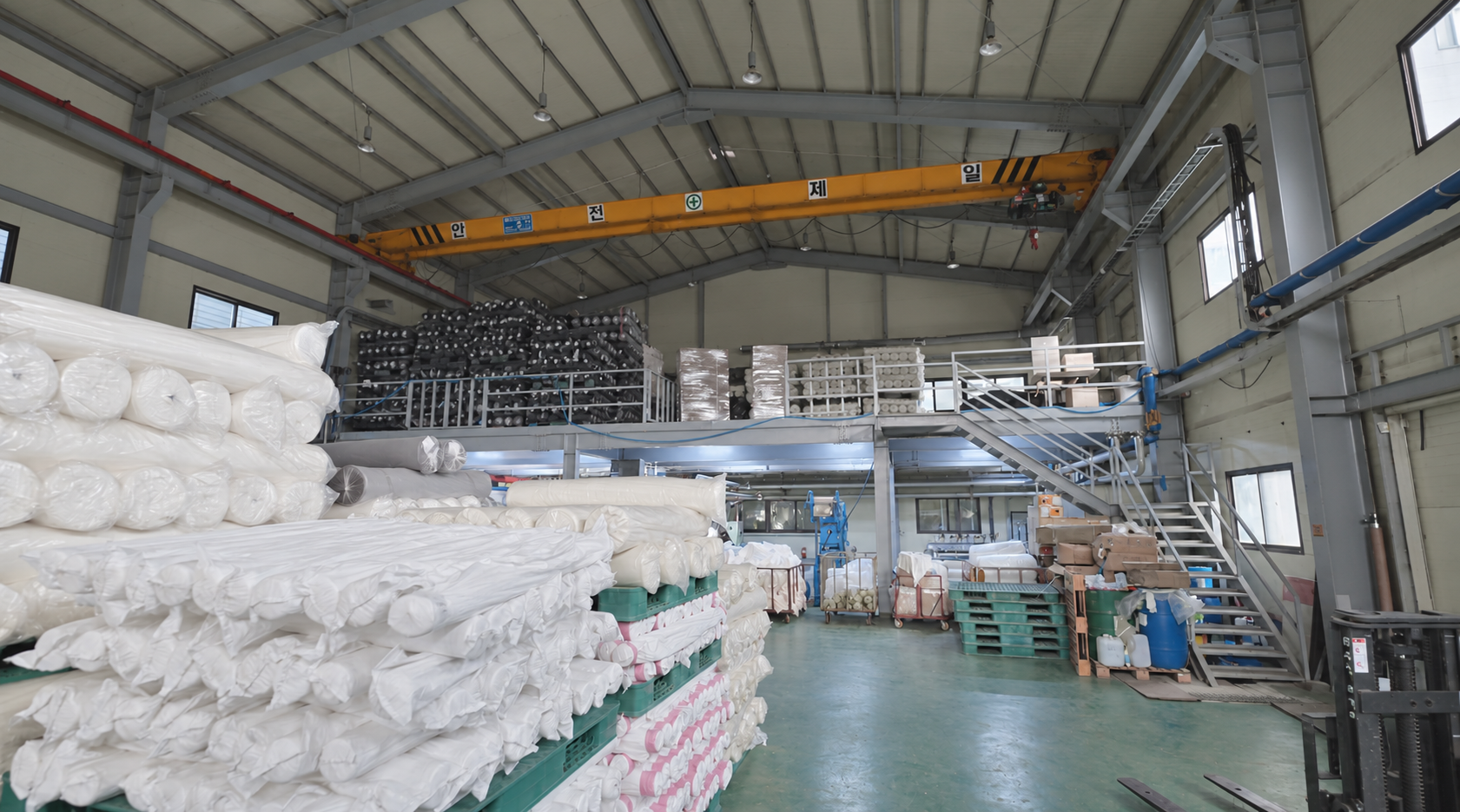 Interior and fabric storage area at the Greenwear Co., Ltd. production facility in Yangju